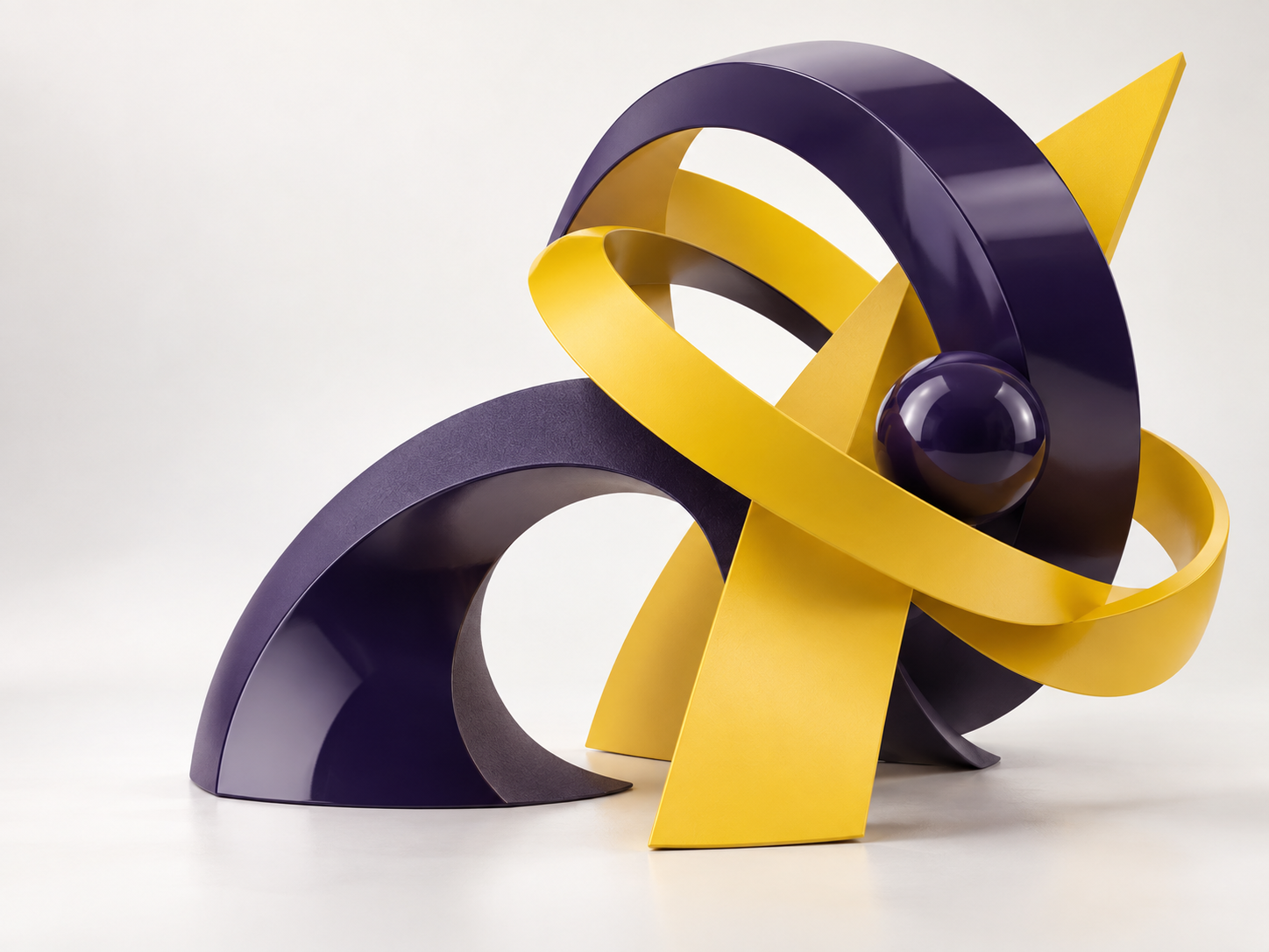 Interlocking purple and yellow sculptures representing creativity and technology